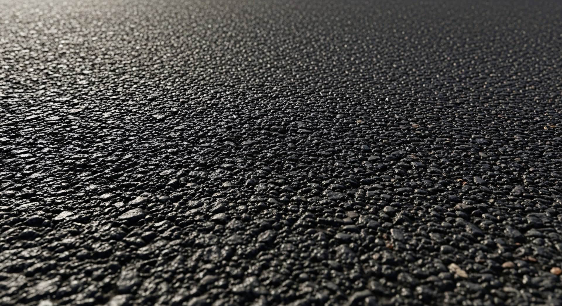 Close-up of Black Asphalt Road Surface Texture.
